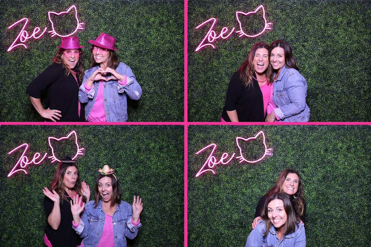 Personalized pink Custom Neon® photo booth sign on green wall styled by @amoreevents