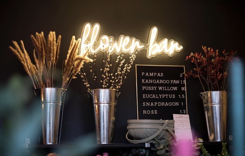 Custom Neon® warm white in-store signage @petalandpad