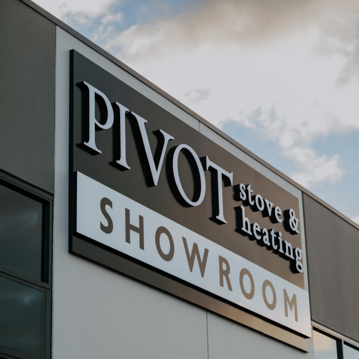 Pivot Stove & Heating channel letter sign on the exterior of the building in daylight