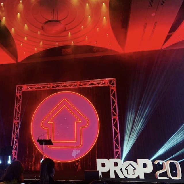 Custom Neon® red & white band logo above the stage during a performance by @kilobravomusic