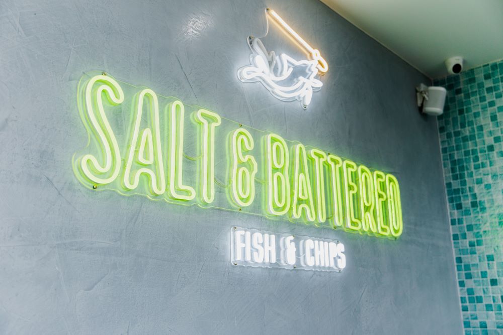 Salt & Battered colour changing Custom Neon® RGB sign on green