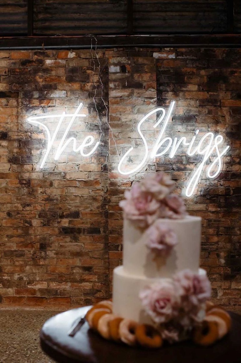 Custom Neon® white last name wedding sign @sbrigs