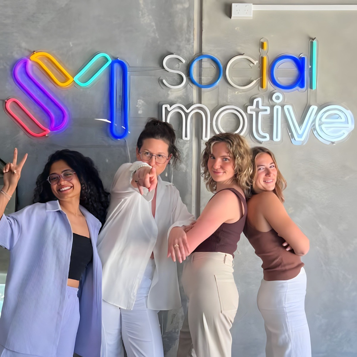 Colorful Custom Neon® office logo sign made for @social.motive