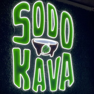 Custom Neon® @sodokava logo with white LED neon framing green UV print