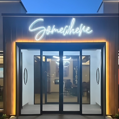Custom Neon® white IP67 waterproof sign above the door @somewhererestaurant