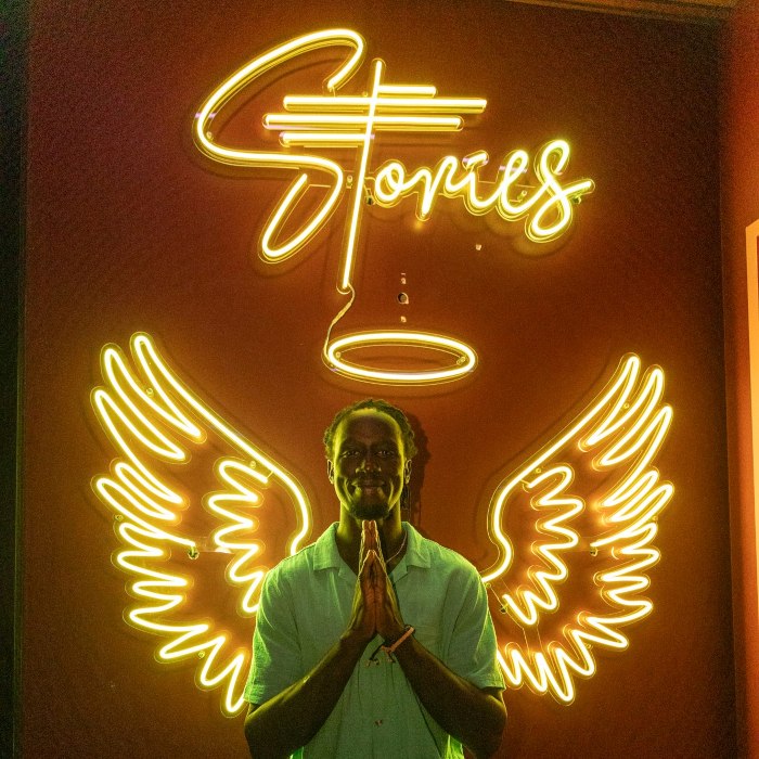 RGB colour changing @stories.au branded angel wings Insta wall sign made by Custom Neon®