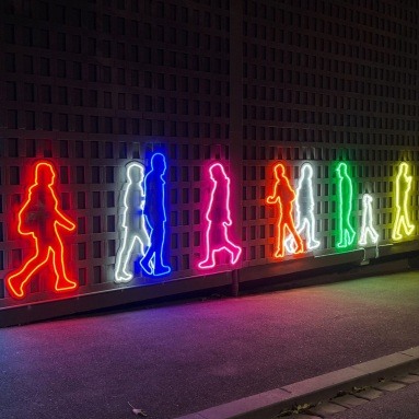 Custom Neon® colourful animated outdoor artwork of people walking @cityofgreatergeeong