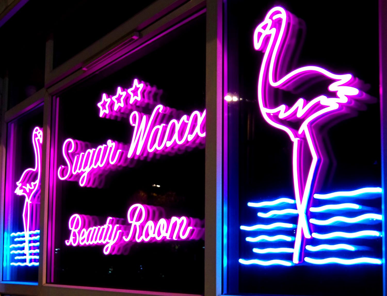 Custom Neon® pink window sign @sugarwaxx photo@tijavolksone
