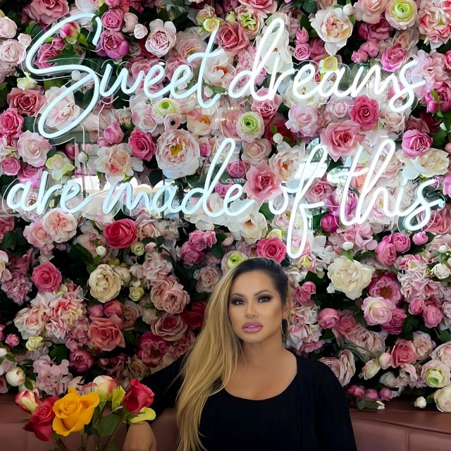 Sweet Dreams are Made of This Custom Neon® sign based on the song lyrics by Eurythmics on a flower wall @plateddreamscafe featuring @starrrrr_la