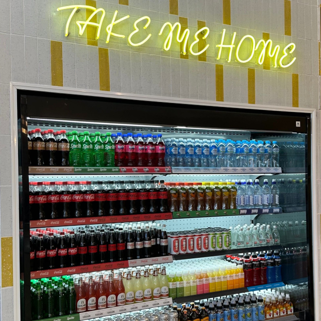 Take Me Home yellow Custom Neon® sign above the beverage cabinet @thelittlespoonco
