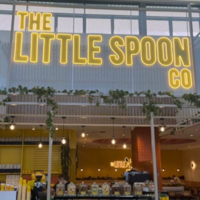 Large yellow coffee shop signage by Custom Neon® @thelittlespoonco