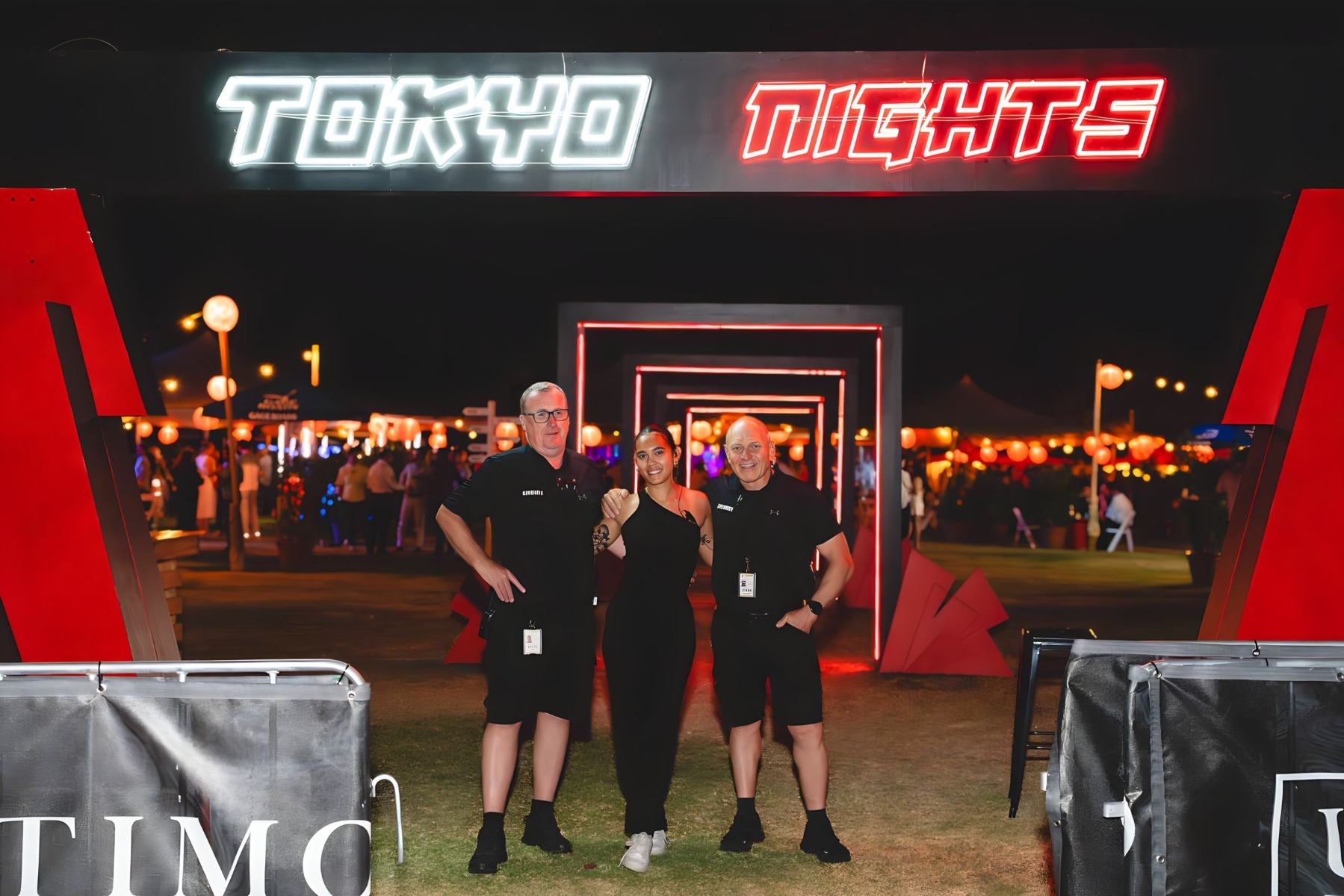 Custom Neon® red and white Tokyo Nights sign at the entrance to the Tokyo Nights event by Ultimo Catering & Events