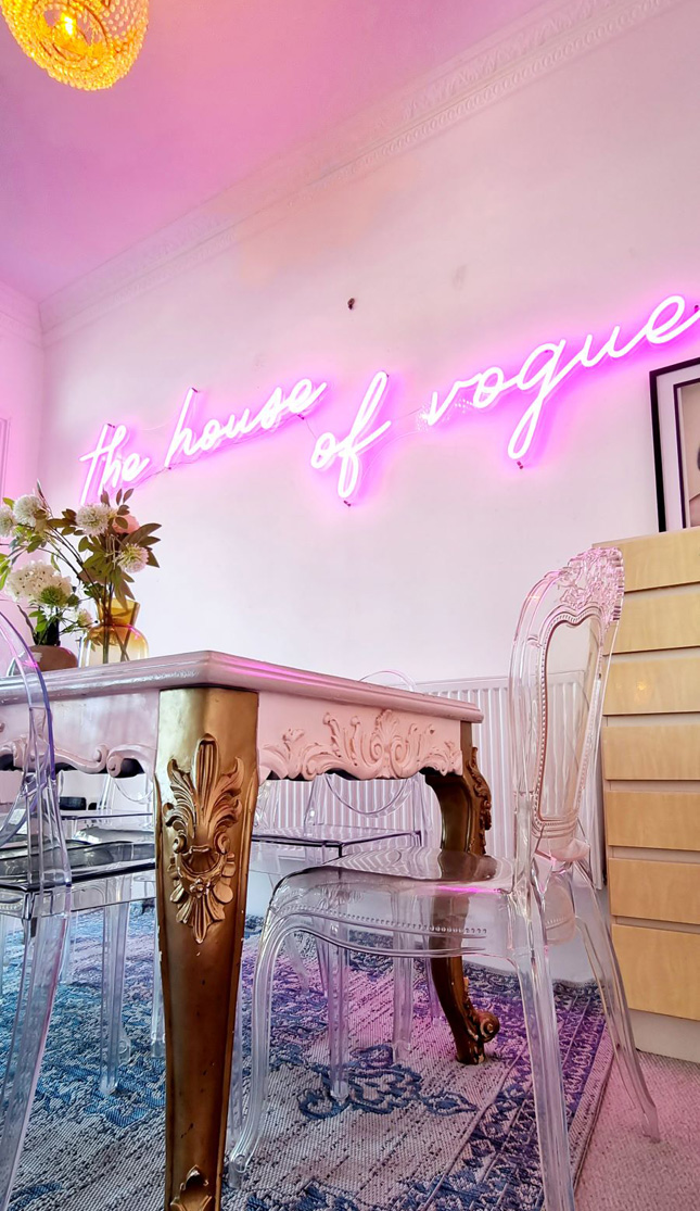Pink Custom Neon® The House of Vogue sign in holiday rental home