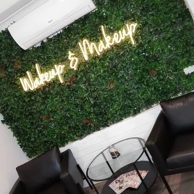 Wakeup and makeup Custom Neon® sign on green wall @_makeupartisttanyagolden