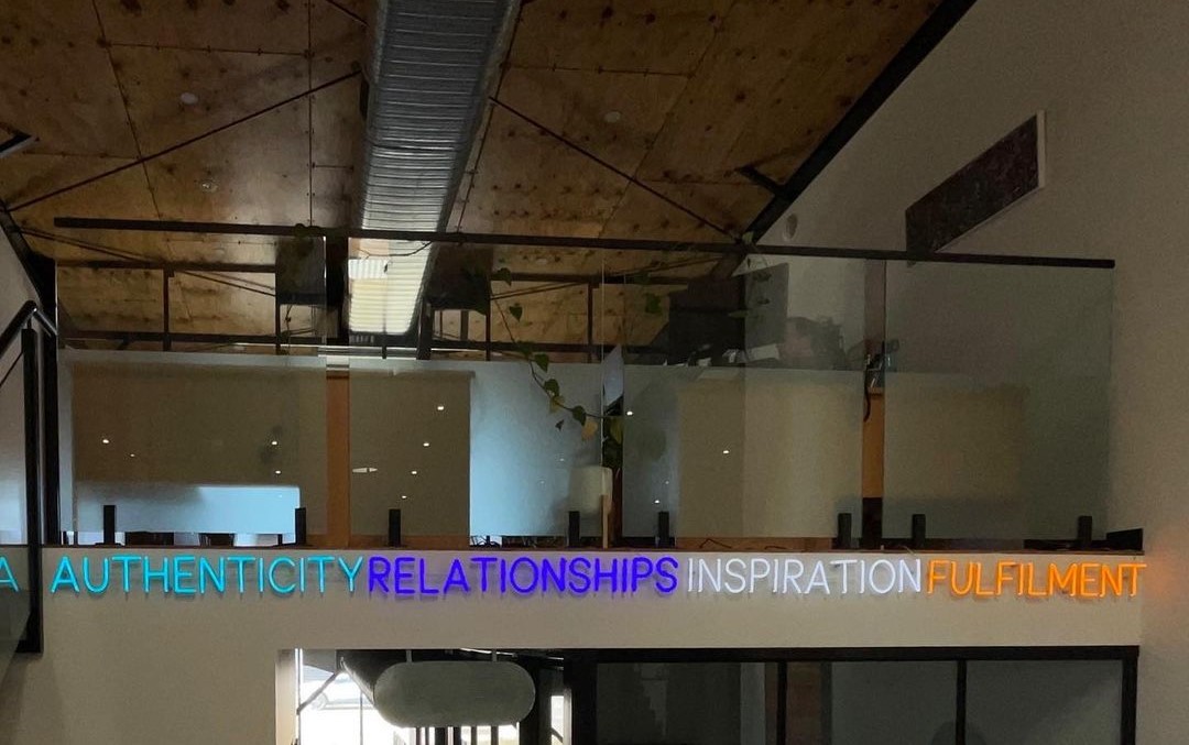 Custom Neon® multi-coloured office sign @wealthbuiltright