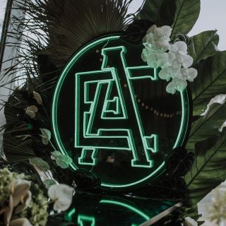 Custom Neon® mint green wedding monogram on black acrylic